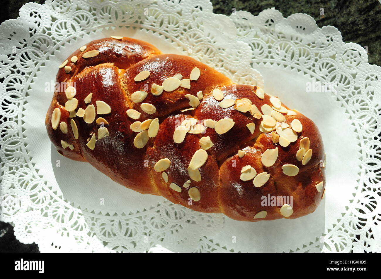 Tsoureki traditional Greek Easter bread with sliced or slivered almonds Stock Photo