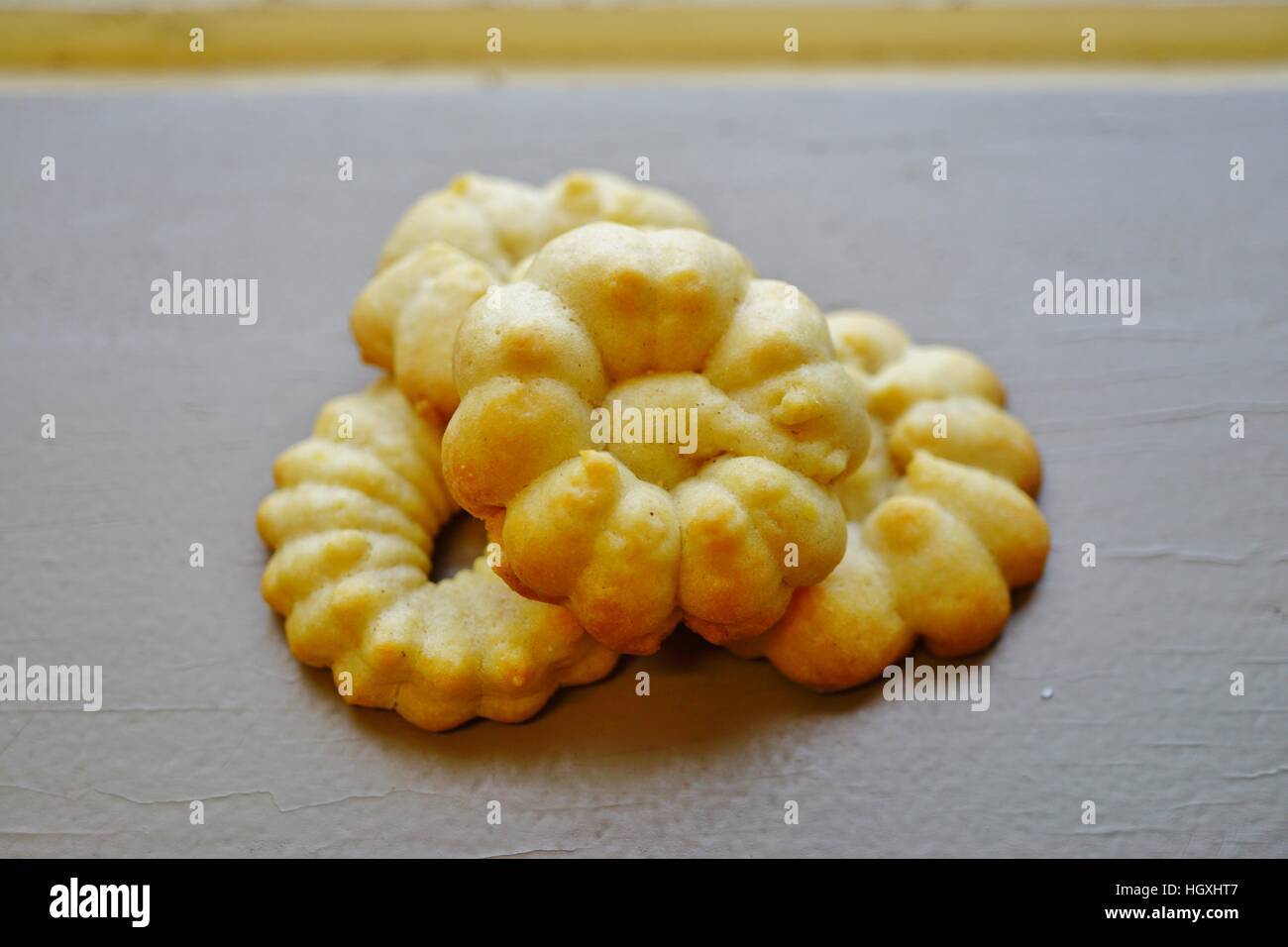 Homemade flower shaped butter cookies made with a cookie press Stock