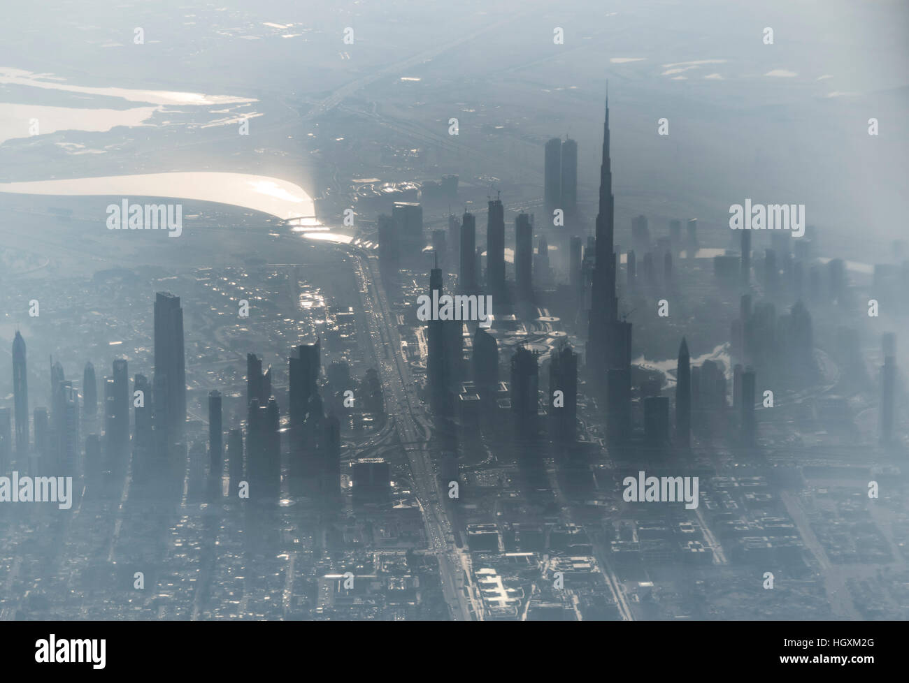 Overview of Dubai, from airplane. All tall buildings are visible in the mist, including Burj Khalifa Stock Photo