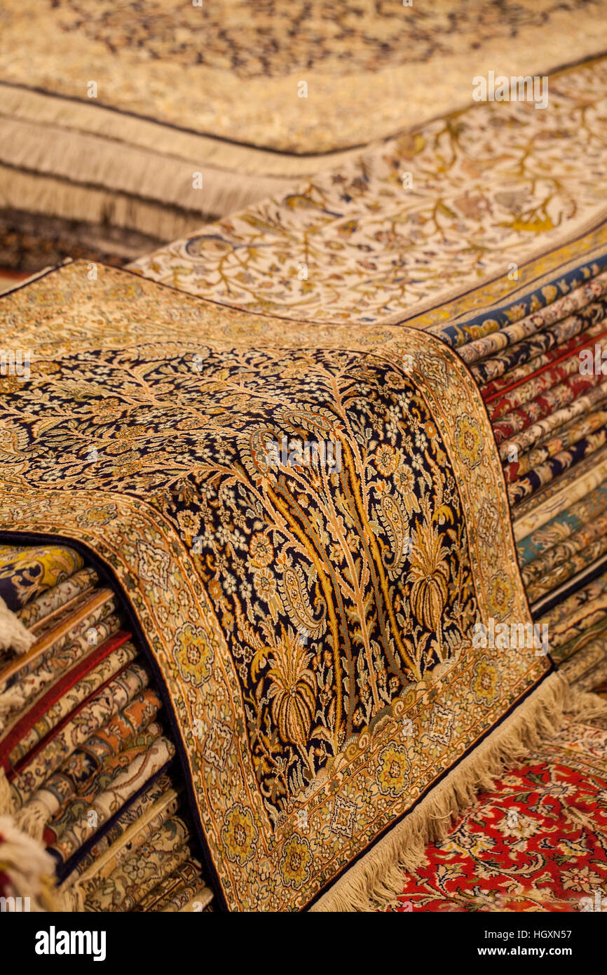Colorful oriental carpets hanging in a market for sale Stock Photo