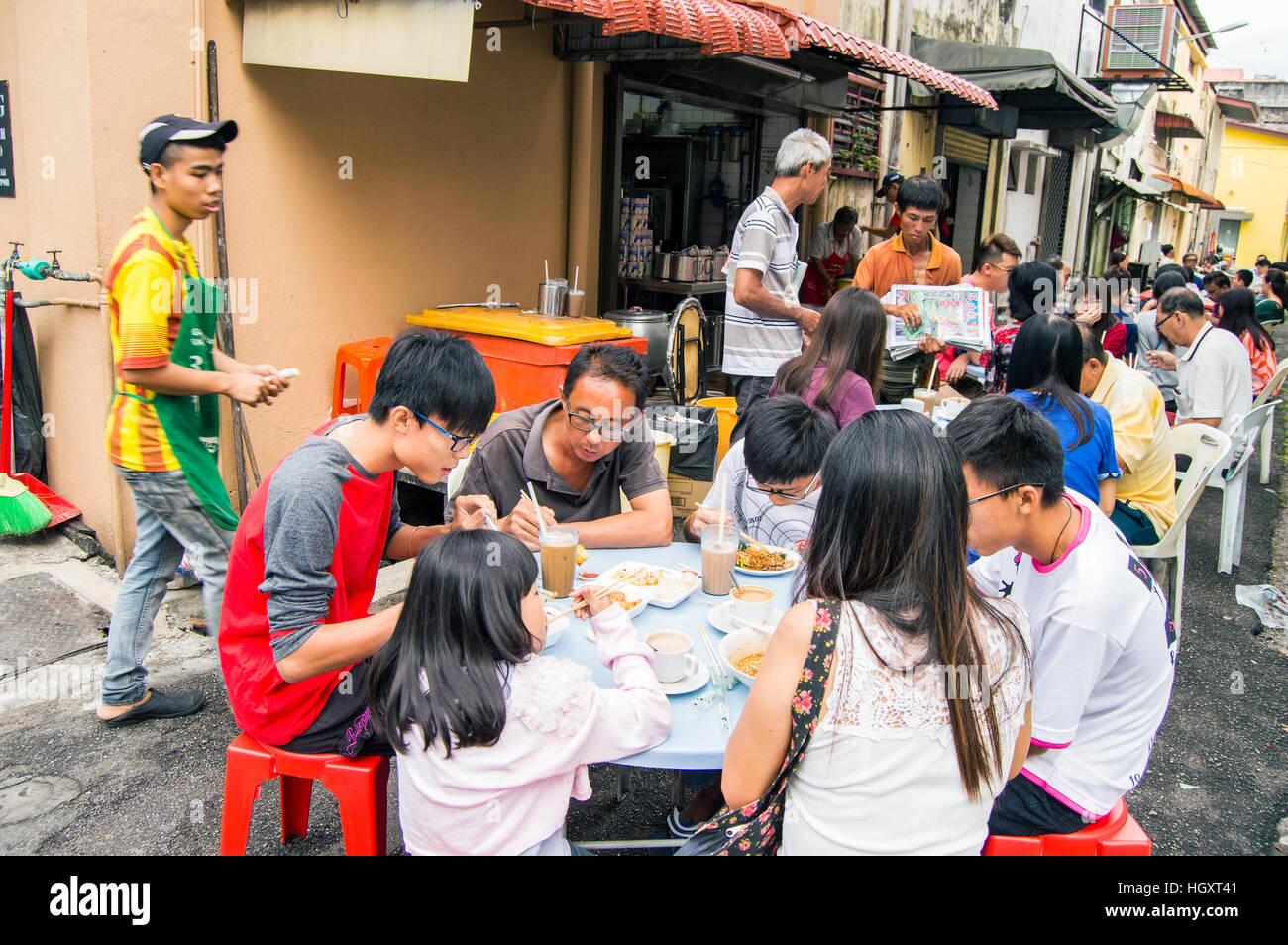 Dining in a coffee shop laneway, old town, Ipoh, Perak, Malaysia Stock Photo