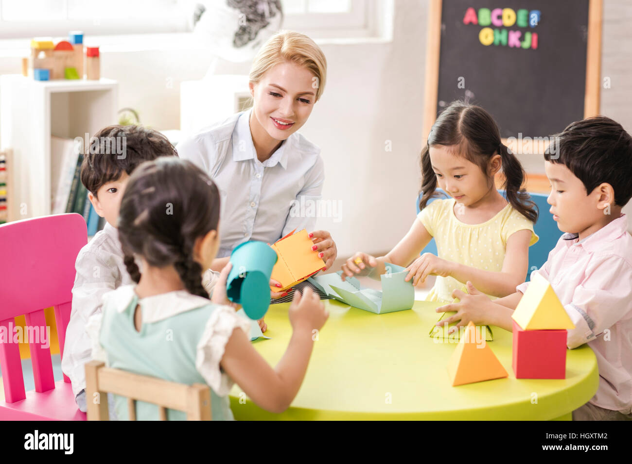 Children and their teacher hi-res stock photography and images - Alamy