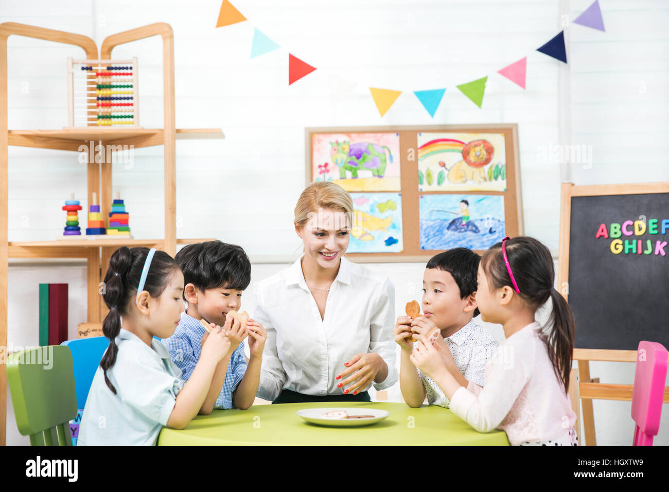 Kindergarten children and foreign teacher Stock Photo