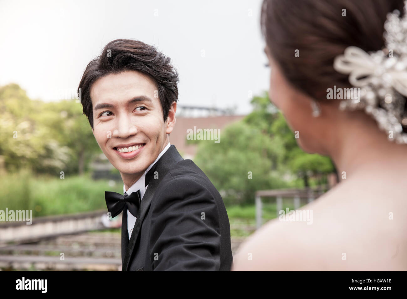 Smiling groom and bride Stock Photo - Alamy