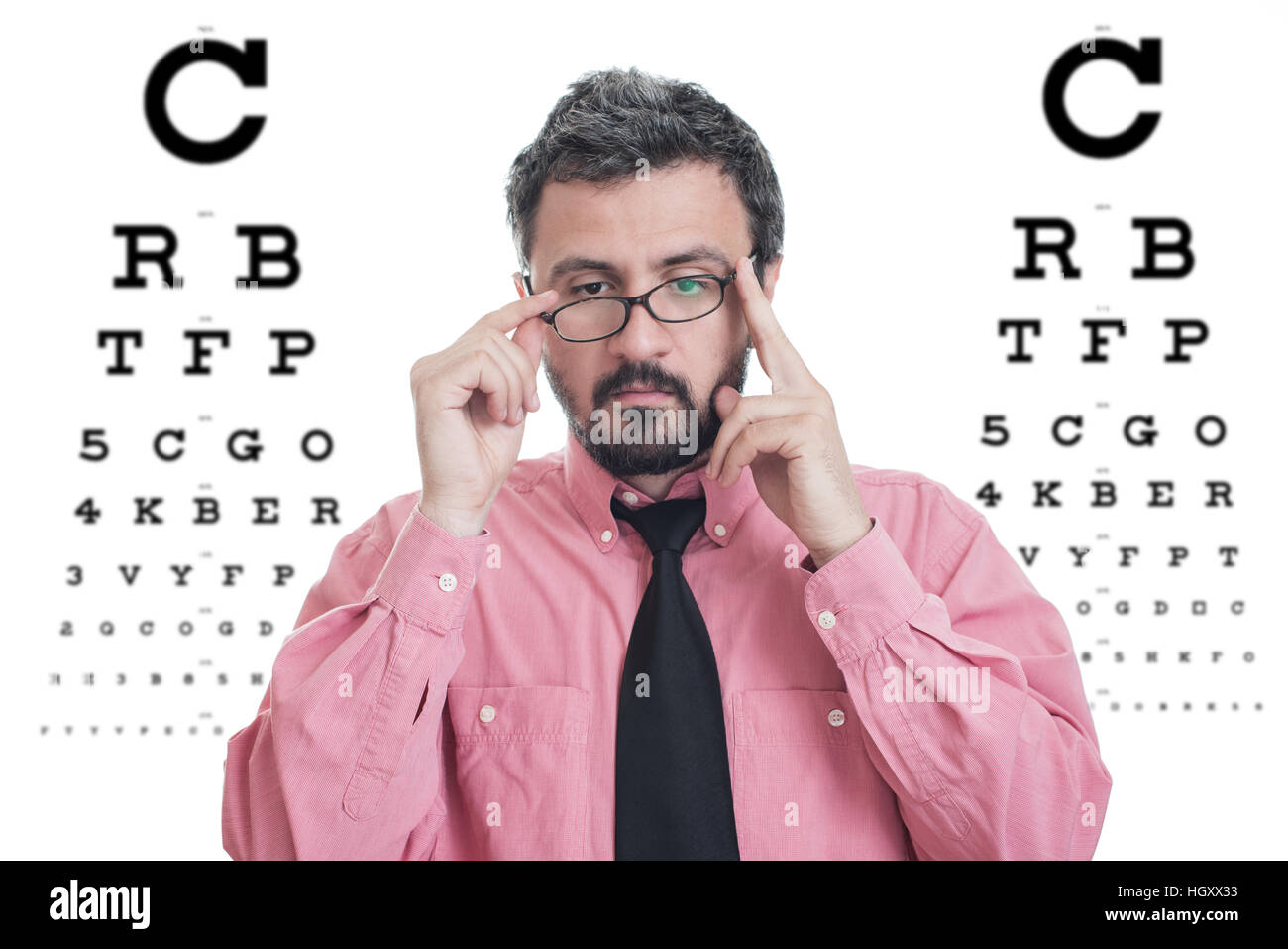 Man taking an eye exam and wearing glasses Stock Photo Alamy