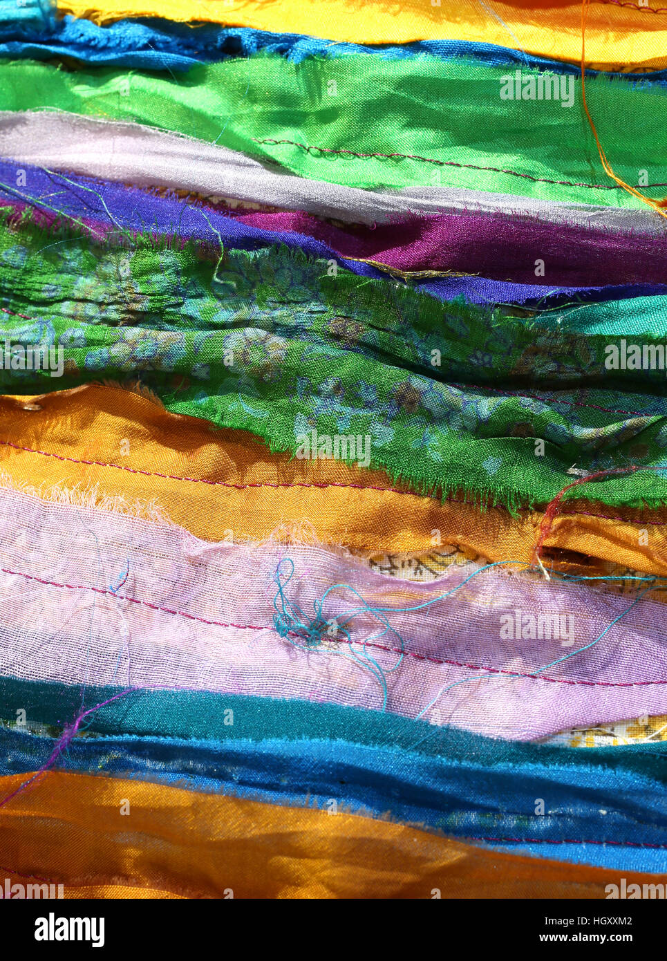 multicolored background of fabrics of cotton and synthetic Stock Photo