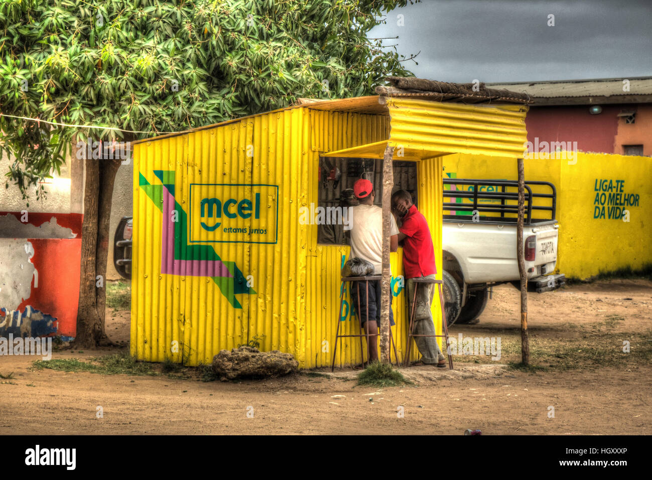 MCEL phone card shop painted in the colours of the Mozambiqan telephone company Mcel in rural Catembe, Mozambique. Stock Photo