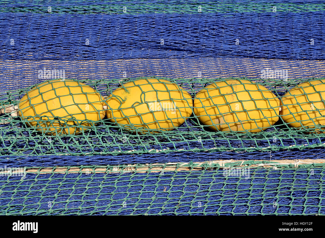 Closeup fishing nets and yellow floats in spanish port Stock Photo Alamy