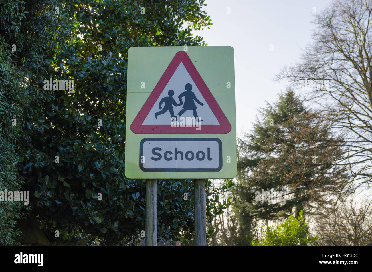 School warning sign on road by school Stock Photo