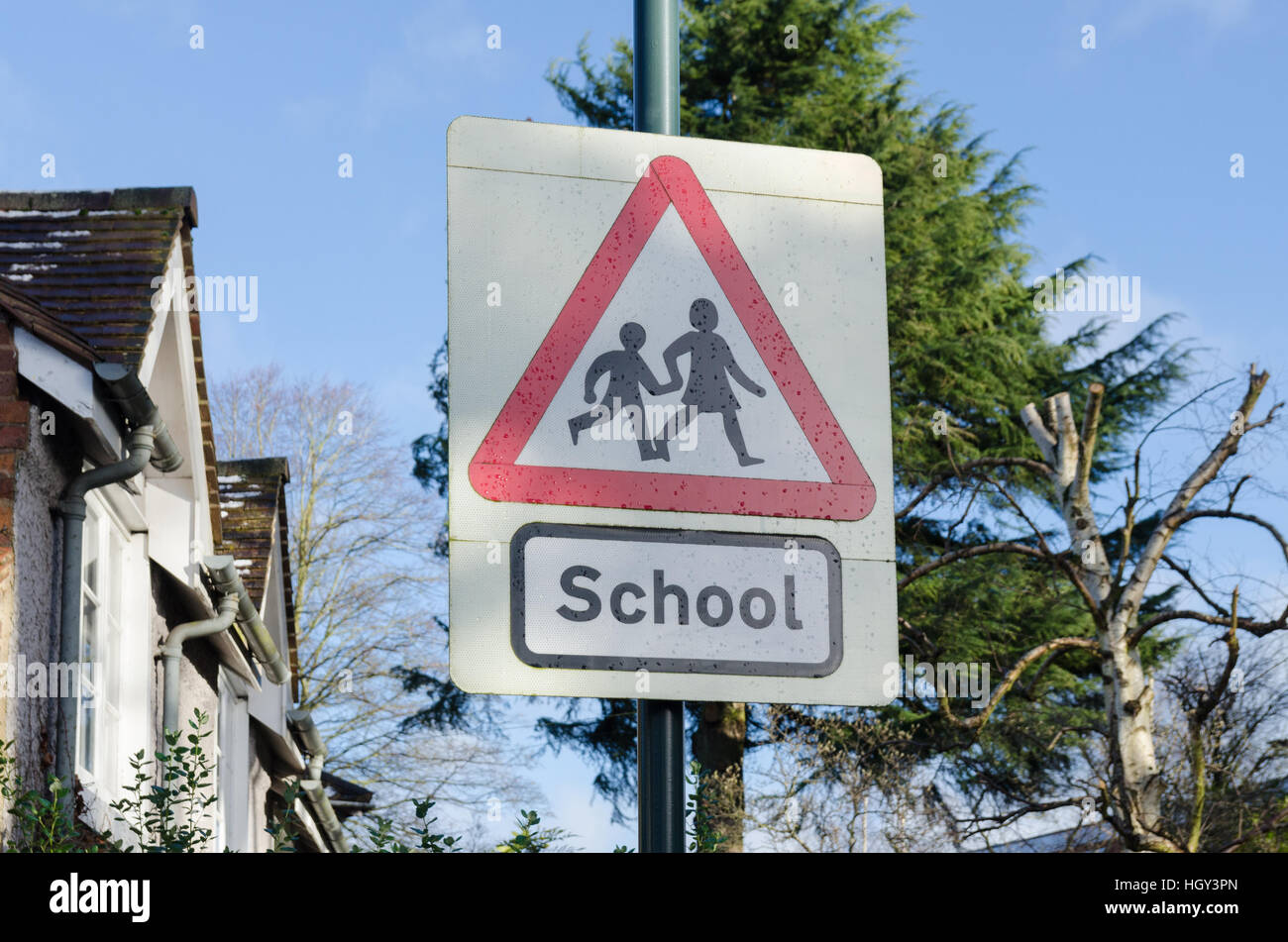 School warning sign on road by school Stock Photo