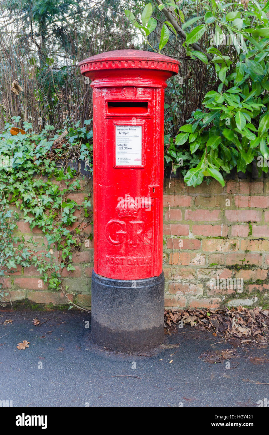 Bright red post box Stock Photo