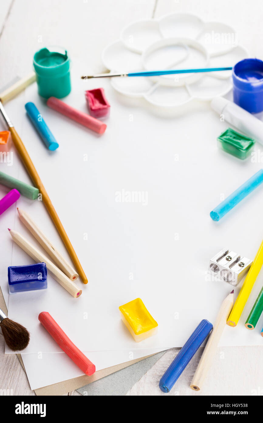 Accessories to drawing: paper, paints, brushes, pencils. Top view Stock