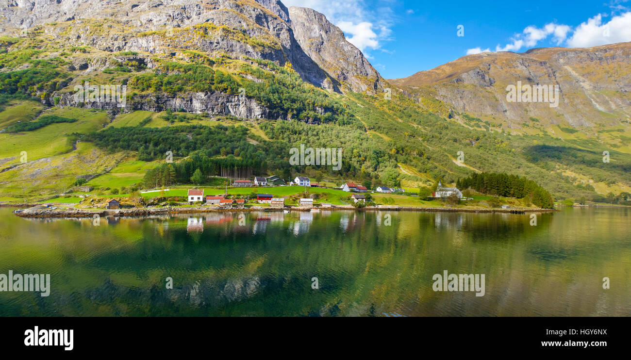 The small wooden houses located on the fjord shore, Norway Stock Photo ...