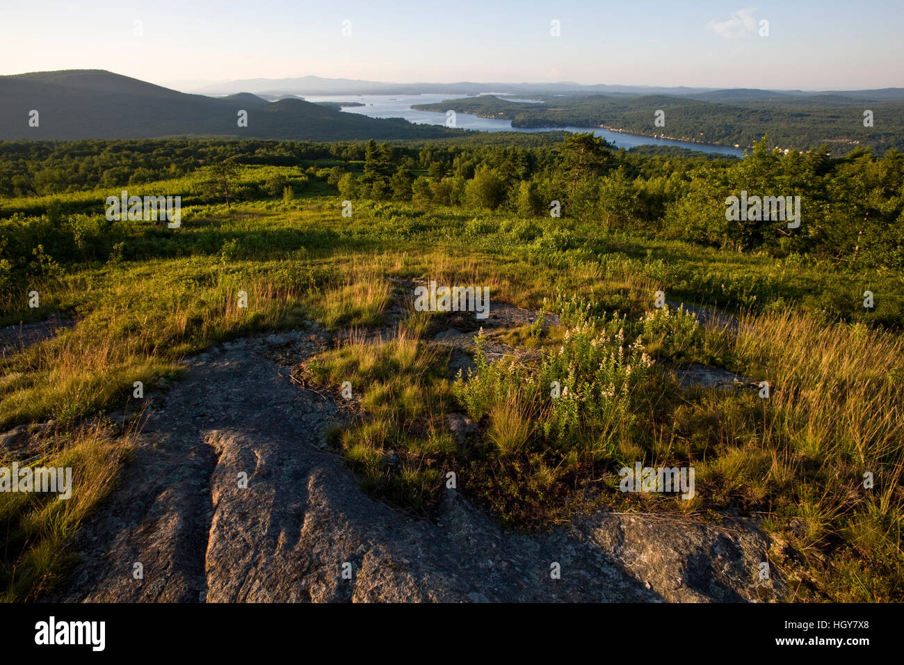 A hilltop field above Lake Winnipesauke in Alton, New Hampshire Stock