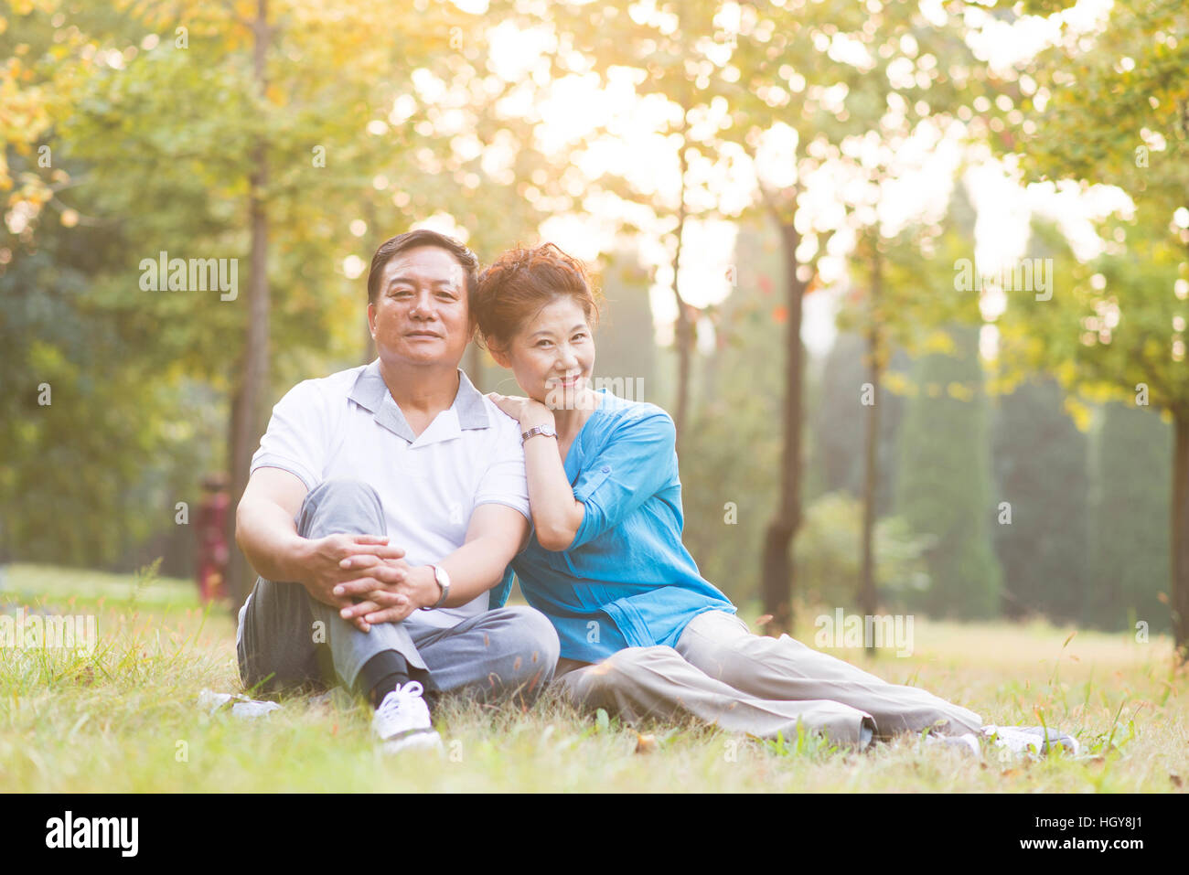 Love the elderly couple in the park early in the morning Stock Photo
