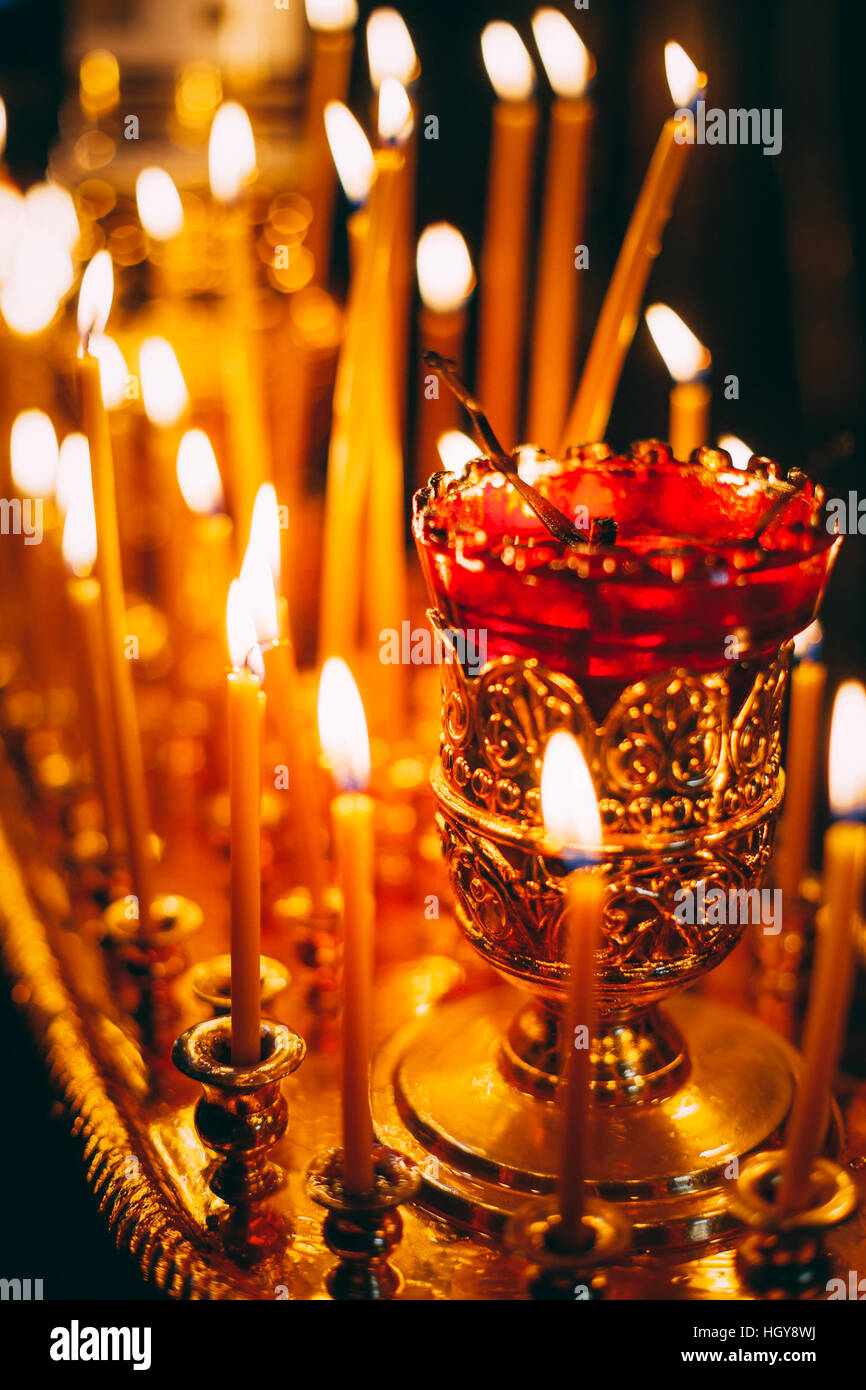 Group Of Burning Church Candles At Dark Background Stock Photo Alamy