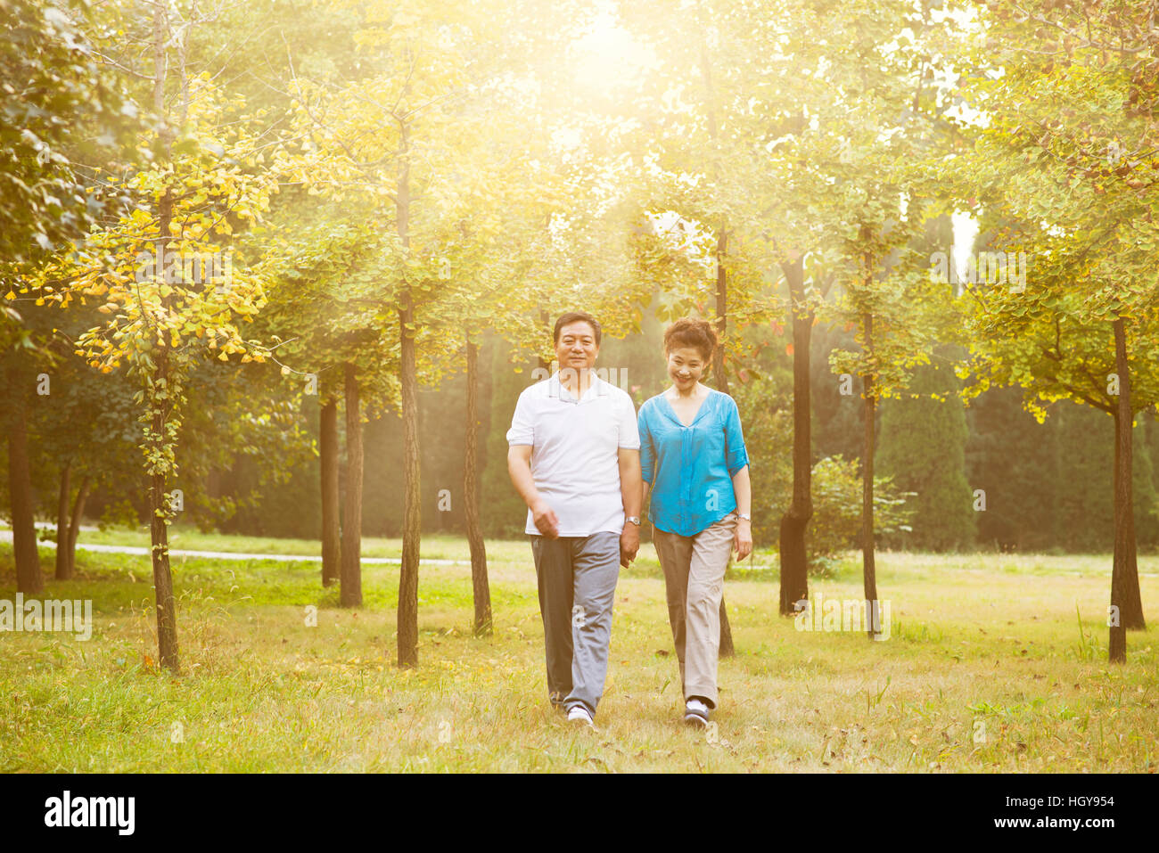 Happy old couple posing at autumn park Stock Photo - Alamy