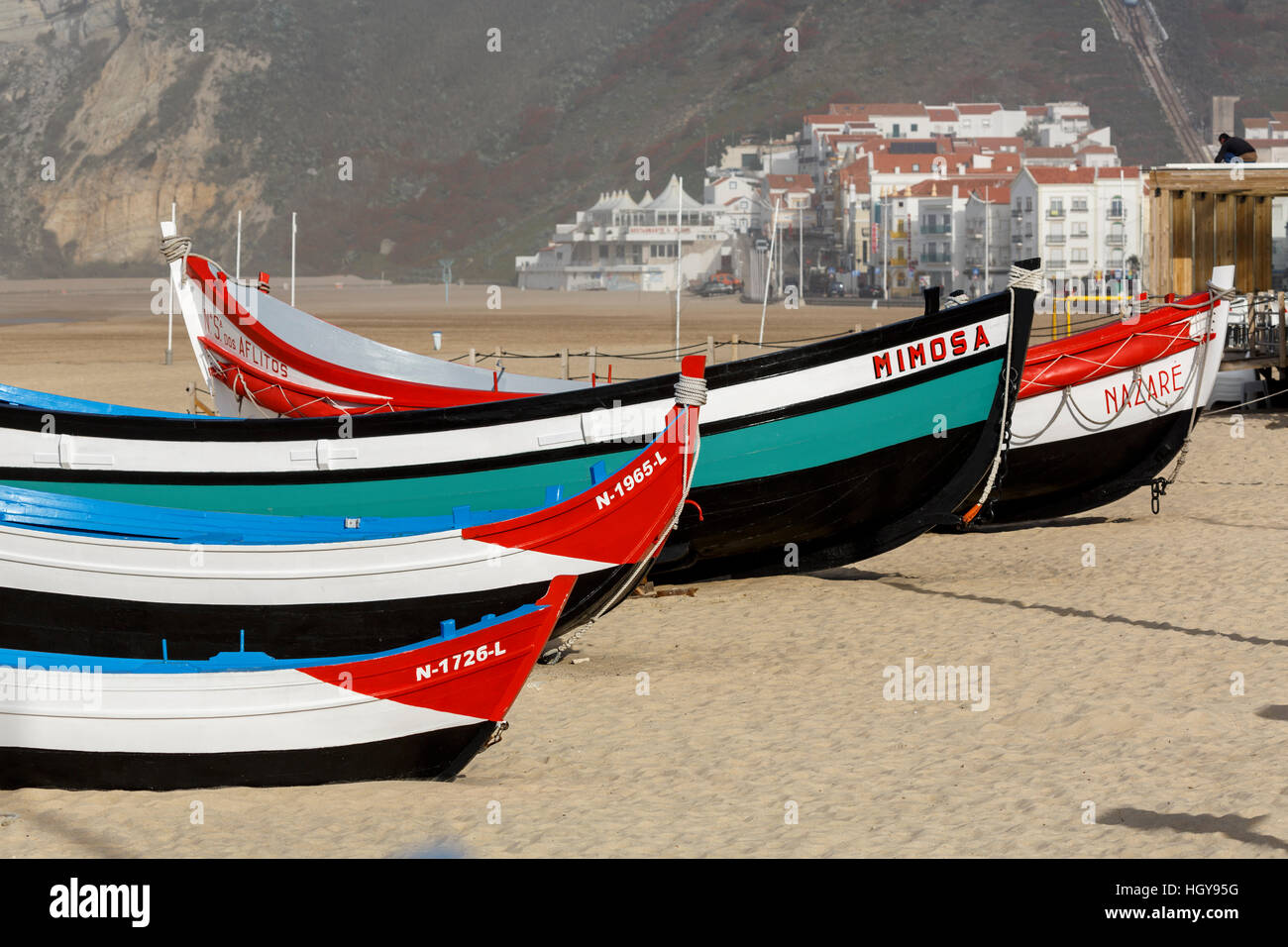 Traditional colourful fishing boats on the beach in Nazare on the