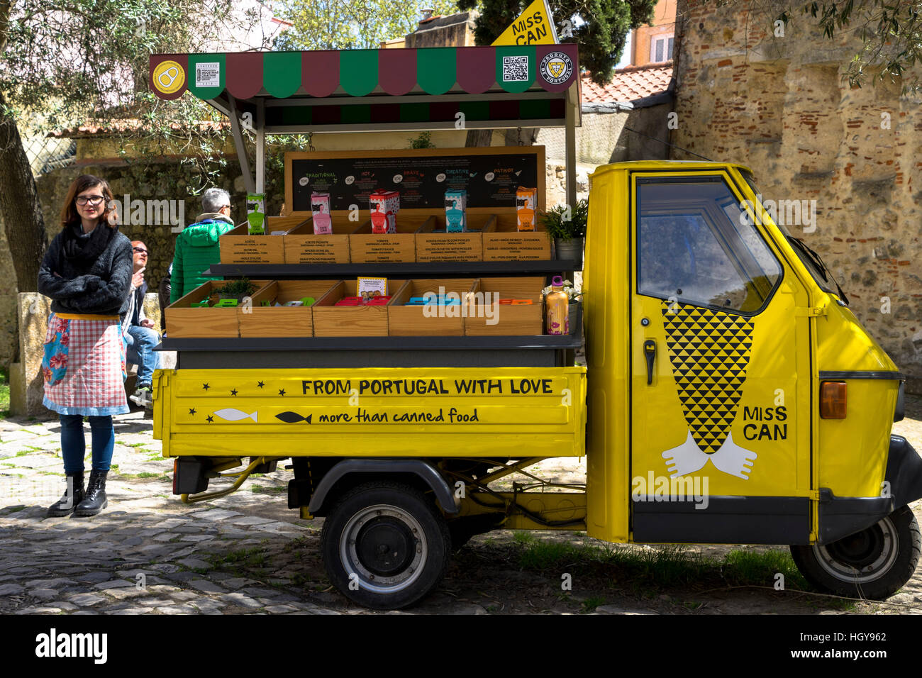 Miss Can" standing by her bright yellow tuk tuk food van selling her famous  Portuguese tinned sardines in Lisbon Portugal Stock Photo - Alamy