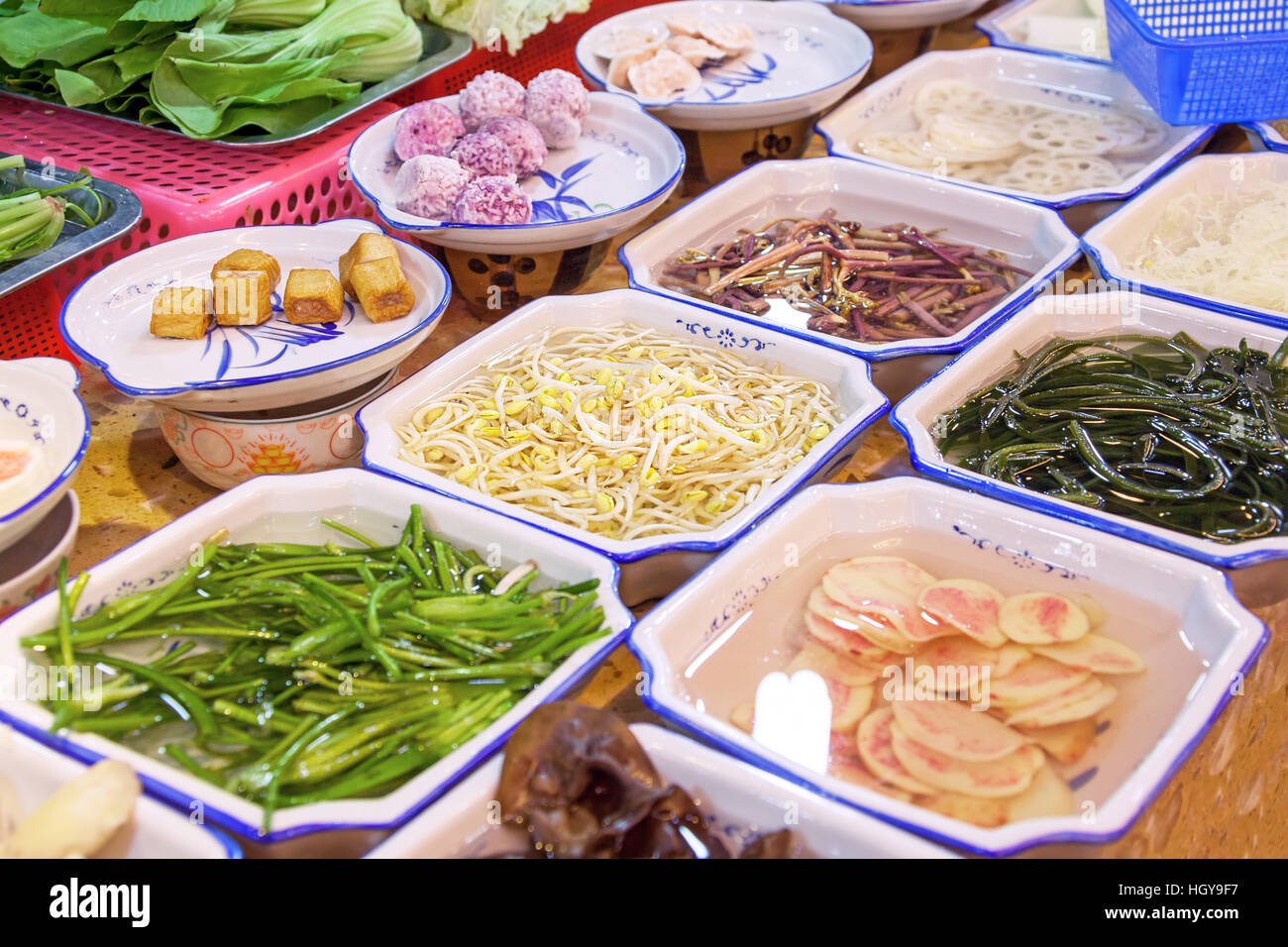 Variety of Chinese dishes at the market, Chinese street food concept. Stock Photo