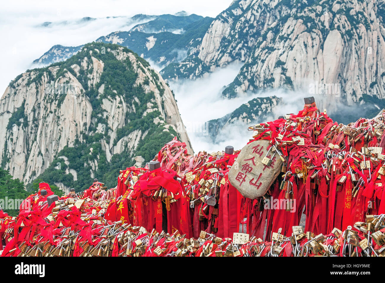 Majestic Huashan mountains with memorable red ribbons and traditional padlocks of lovers people in Huashan mountains, China Stock Photo