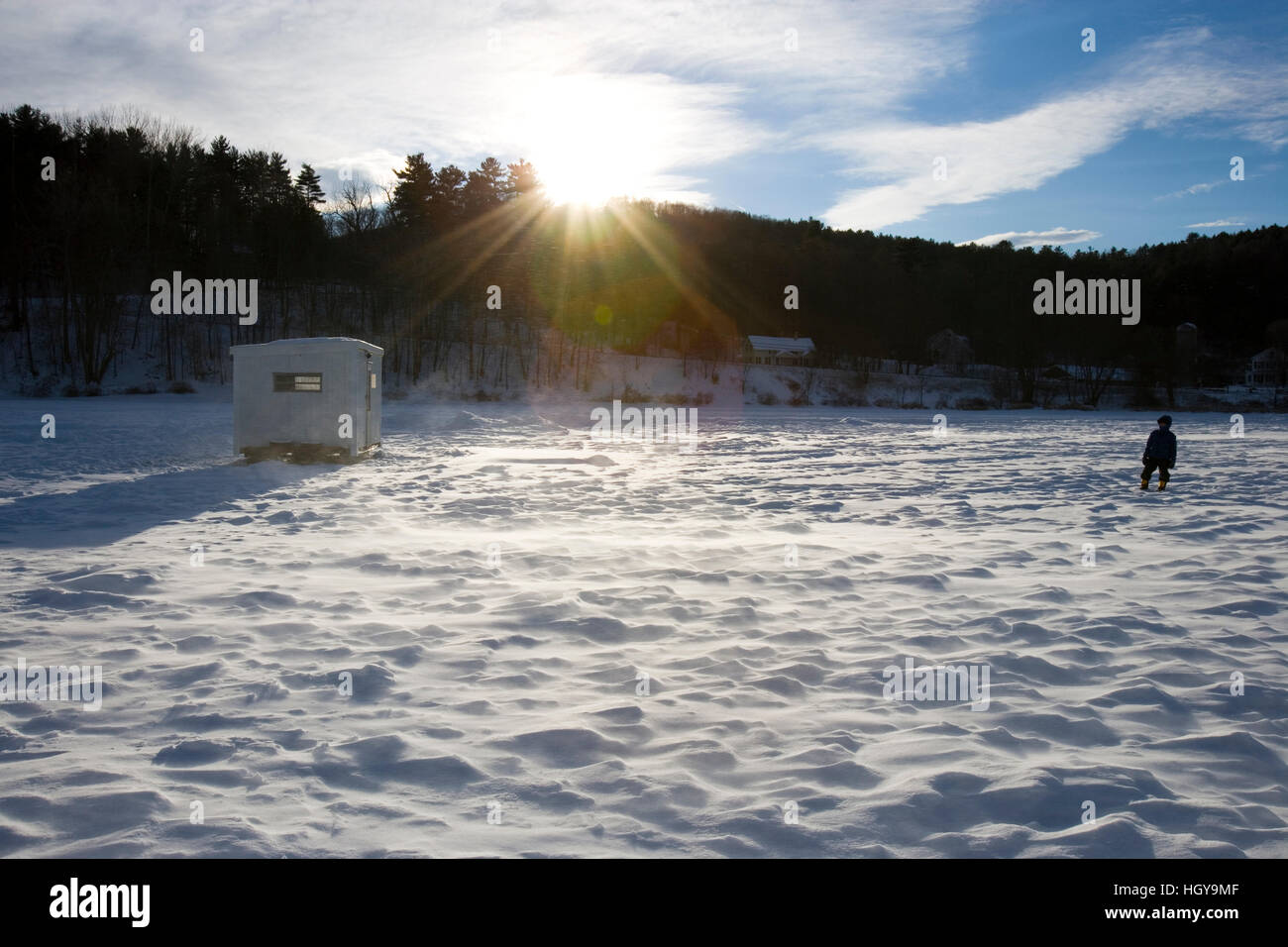 A boy and an ice fishing shack on the frozen West River in Brattleboro