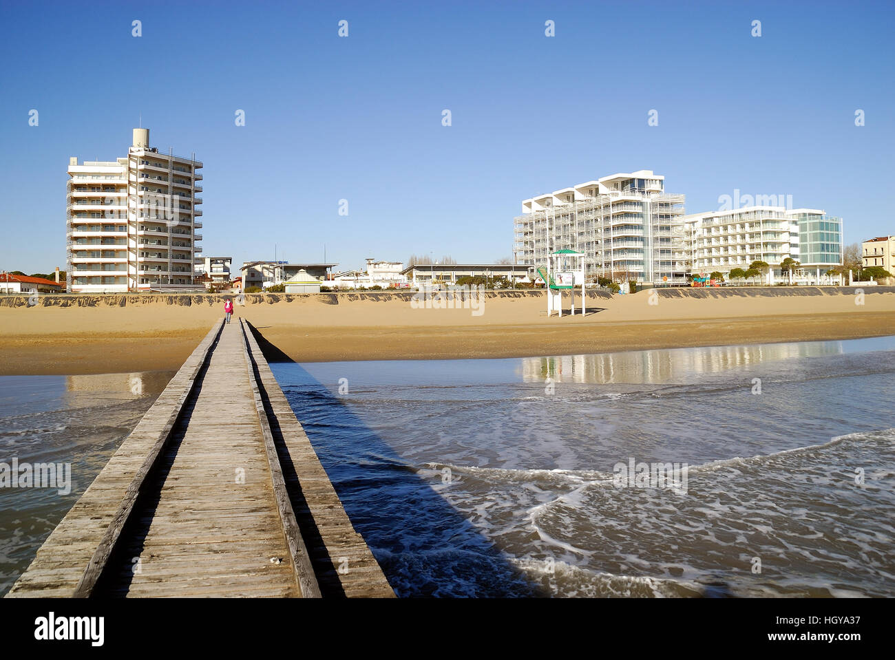 Jesolo, Veneto, Italy.  Jesolo Lido beach. A wooden pier, hotels and resorts. Stock Photo