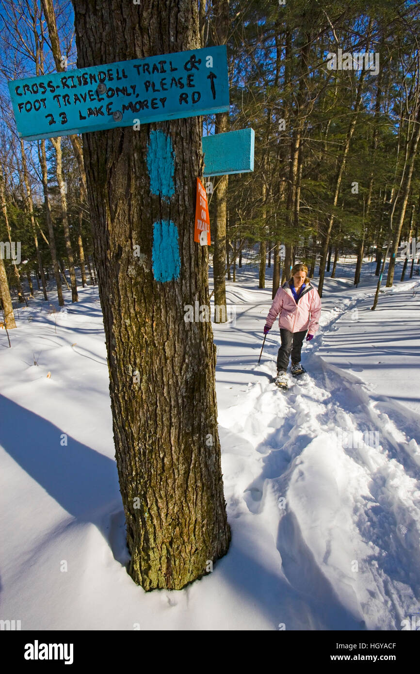 A woman snowsoes on the CrossRivendell Trail in West Fairlee, Vermont