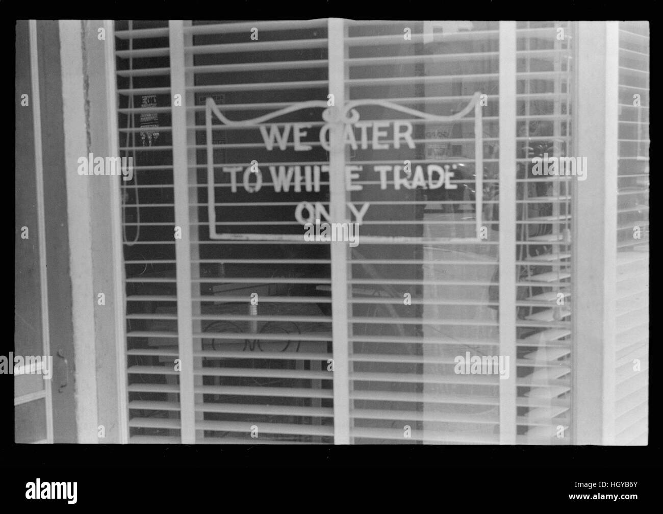 Jim Crow Sign on restaurant window. Stock Photo