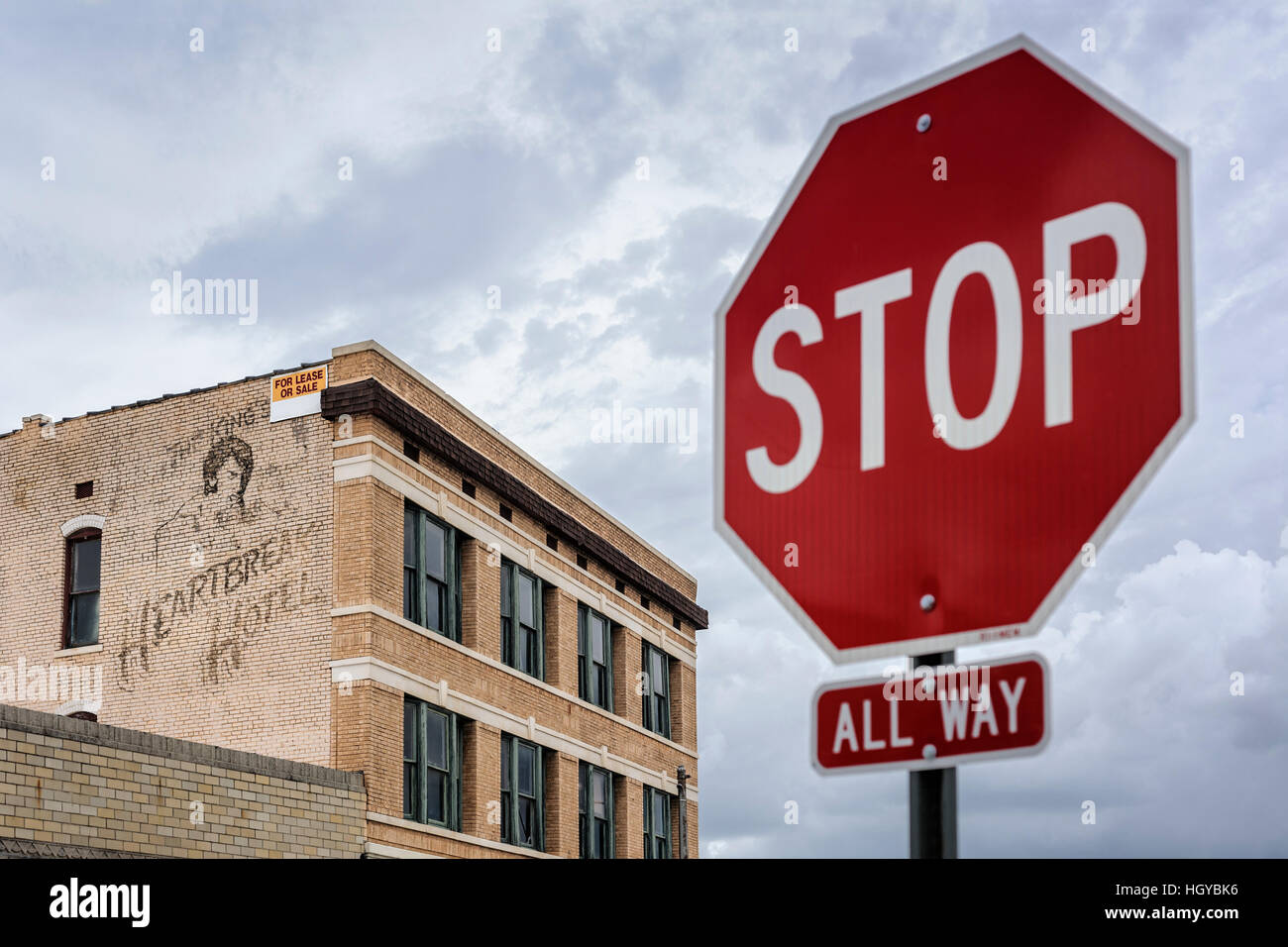 Stop sign and abandoned hotel called after Elvis Presley's song Heartbreak Hotel, Memphis, Tennessee, USA Stock Photo