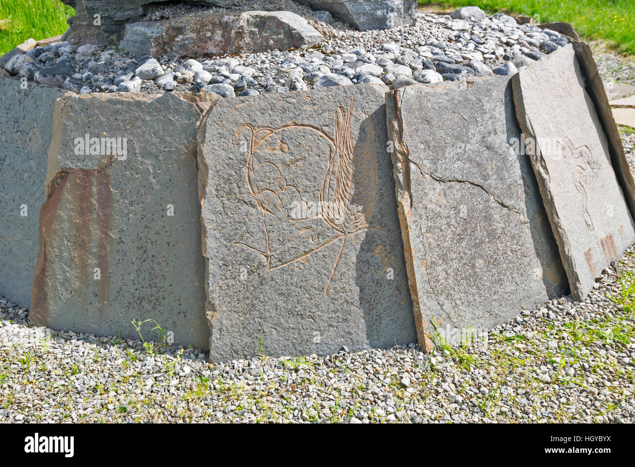 NEIL GUNN MEMORIAL STRATHPEFFER NEAR INVERNESS IN EARLY SUMMER CLOSE UP FLAGSTONES WITH CARVED PICTURES Stock Photo