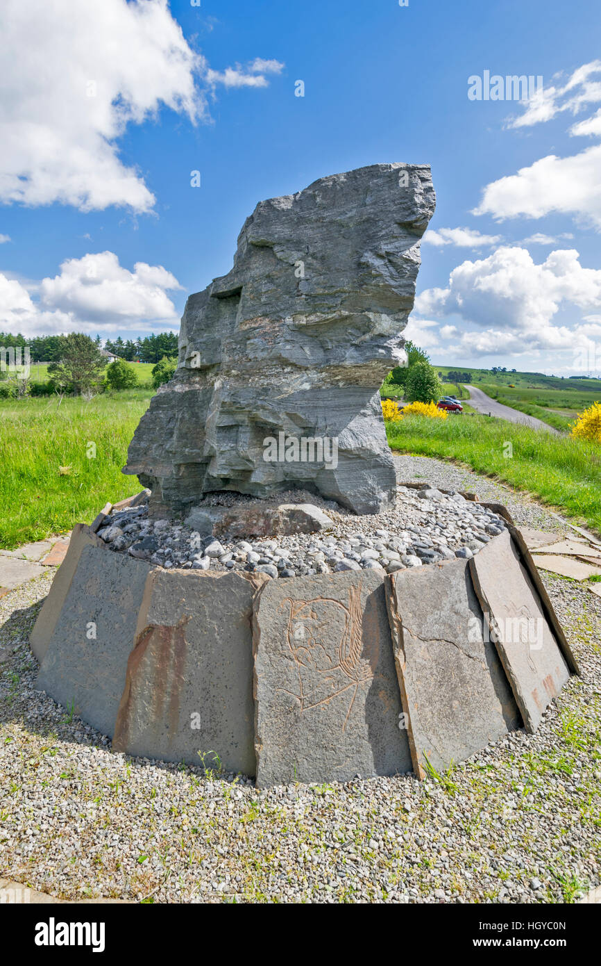 NEIL GUNN MEMORIAL STRATHPEFFER NEAR INVERNESS IN EARLY SUMMER FLAGSTONES WITH CARVED PICTURES Stock Photo