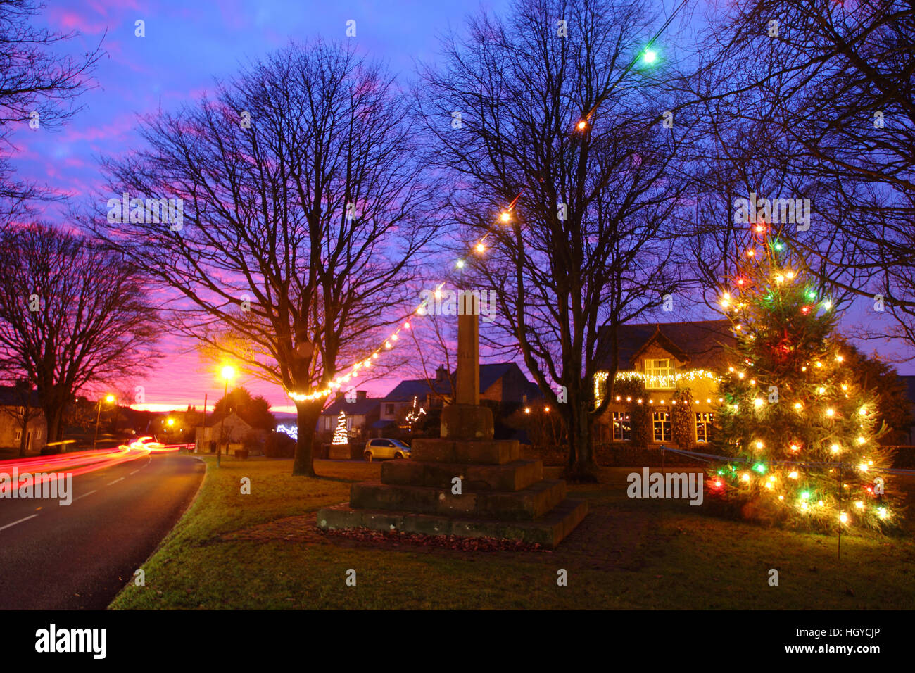 Christmas decorations on the village green at sunset in the centre of