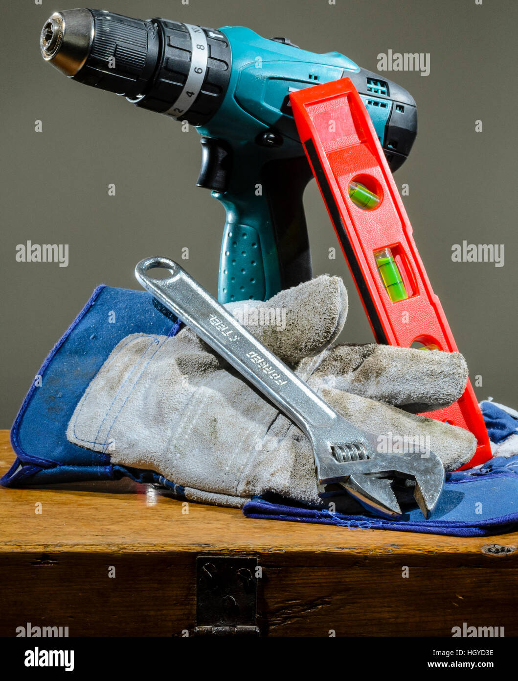 Selection of tools on wooden chest Stock Photo