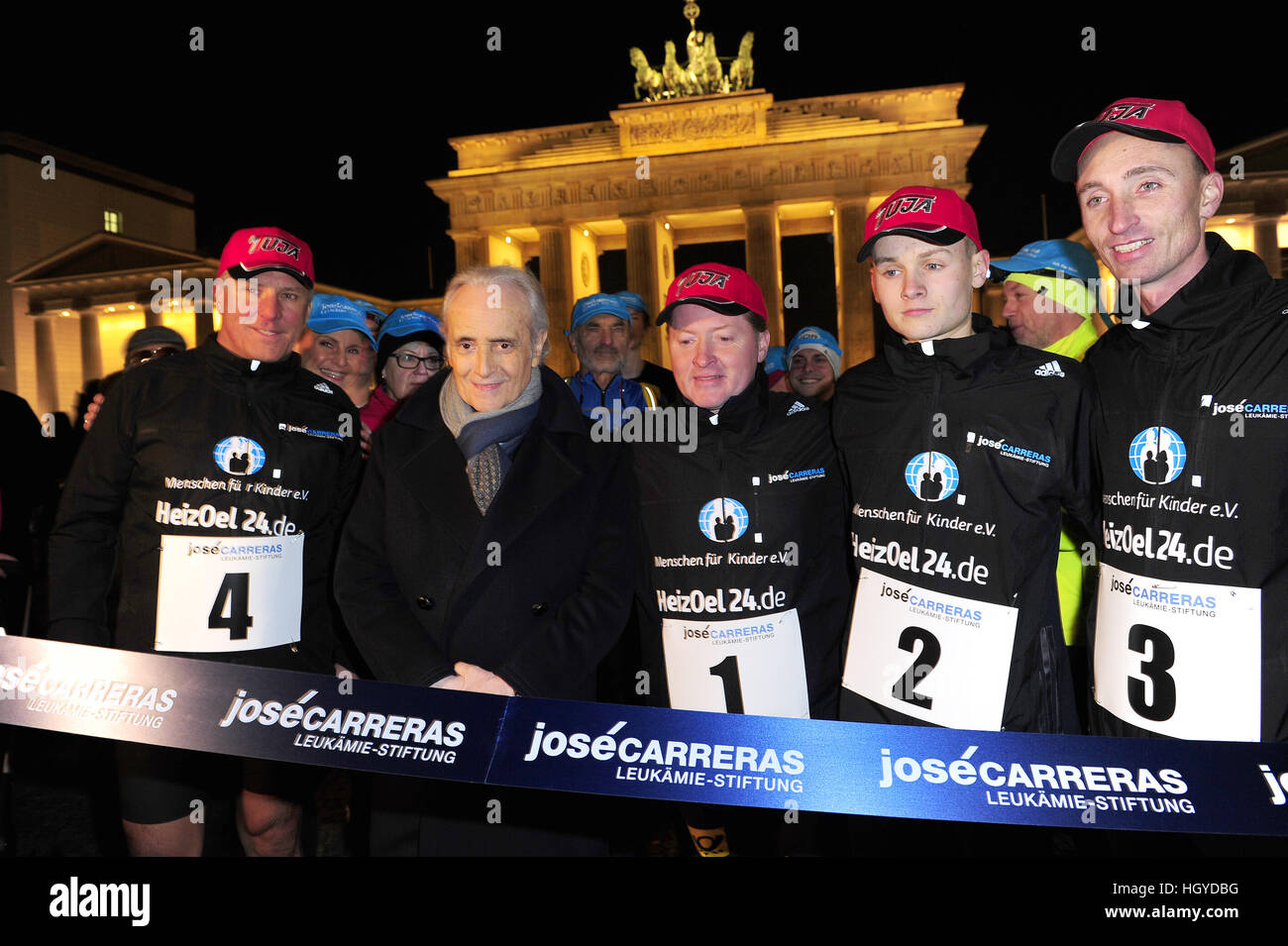 Jose Carreras starts the run with Joey Kelly along the former Berlin wall to the benefit of 'Jose Carreras Leukämie-Stiftung' at Brandenburg Gate.  Featuring: Jose Carreras, Joey Kelly, Läufer Where: Berlin, Germany When: 13 Dec 2016 Stock Photo