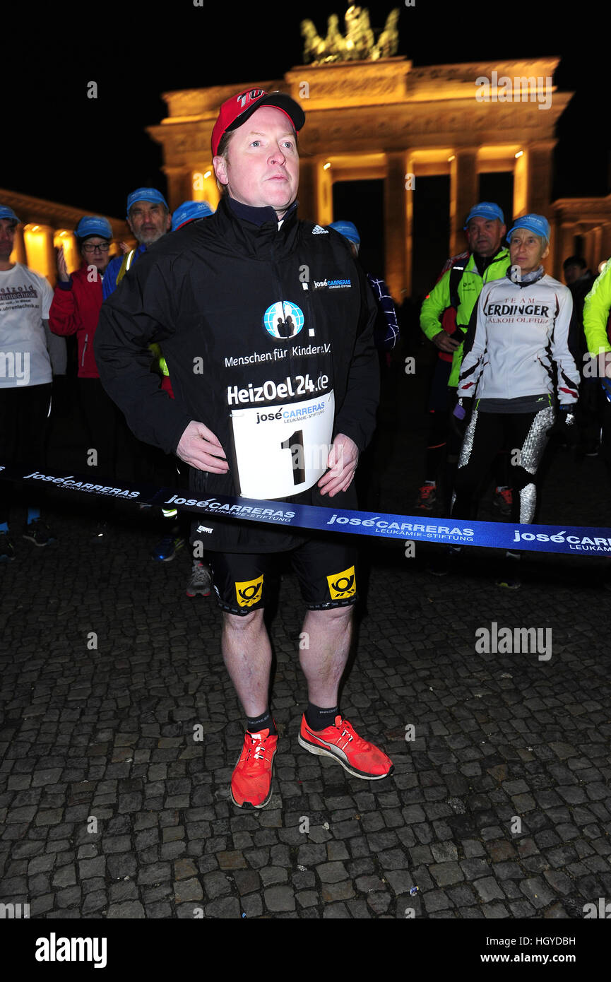 Jose Carreras starts the run with Joey Kelly along the former Berlin wall to the benefit of 'Jose Carreras Leukämie-Stiftung' at Brandenburg Gate.  Featuring: Joey Kelly Where: Berlin, Germany When: 13 Dec 2016 Stock Photo
