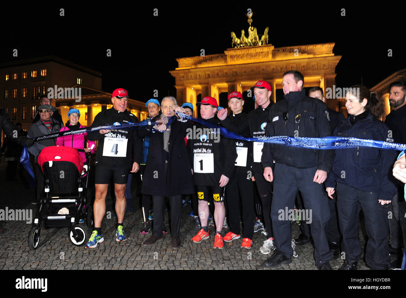 Jose Carreras starts the run with Joey Kelly along the former Berlin wall to the benefit of 'Jose Carreras Leukämie-Stiftung' at Brandenburg Gate.  Featuring: Jose Carreras, Joey Kelly, Läufer Where: Berlin, Germany When: 13 Dec 2016 Stock Photo