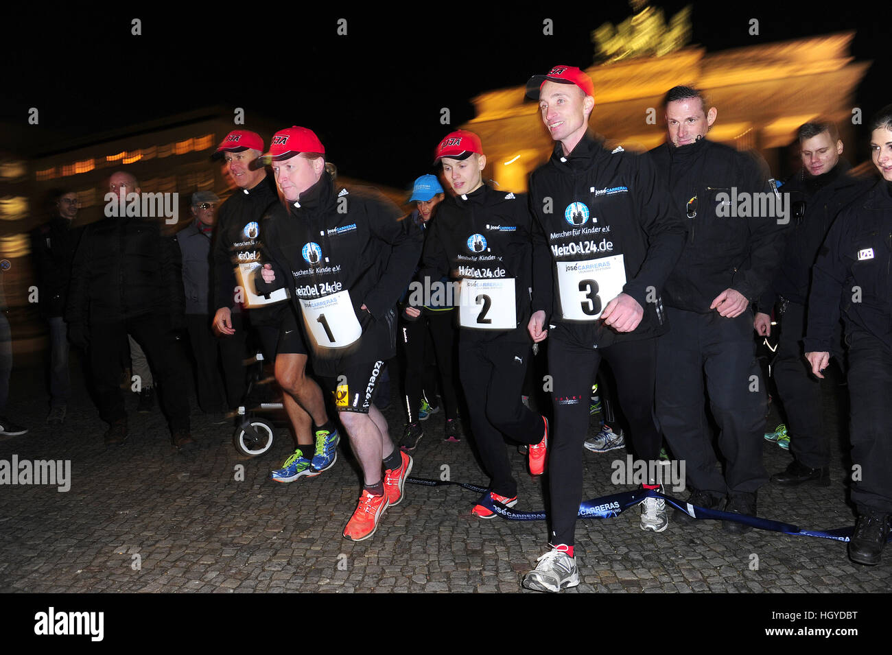 Jose Carreras starts the run with Joey Kelly along the former Berlin wall to the benefit of 'Jose Carreras Leukämie-Stiftung' at Brandenburg Gate.  Featuring: Joey Kelly, Läufer Where: Berlin, Germany When: 13 Dec 2016 Stock Photo