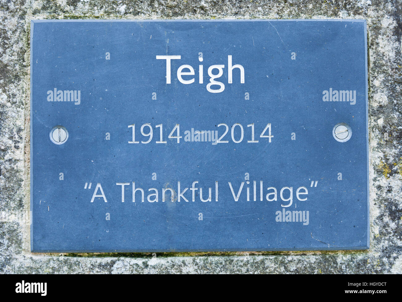 A plaque in the village of Teigh, Rutland, England, commemorating 100 years as a 'Thankful Village' 1914 to 2014. Stock Photo
