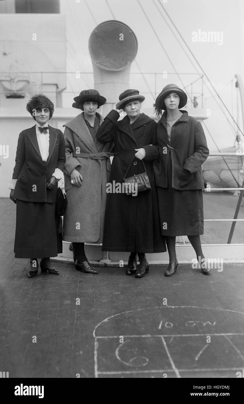 Physicist Marie Curie (2nd Right) Standing with her daughters Irene and Eve, and Mrs. William B. Maloney, on RMS OIympic, Arriving in New York City, New York, USA, to Raise Funds for Radium Research, Bain News Service, 1921 Stock Photo