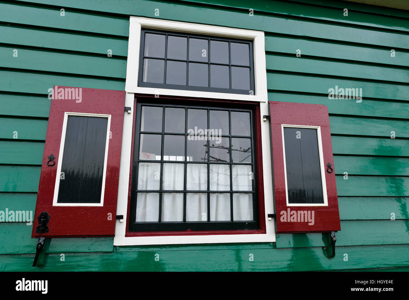 A traditional window of a house with wooden shutters in Zaanse Schans