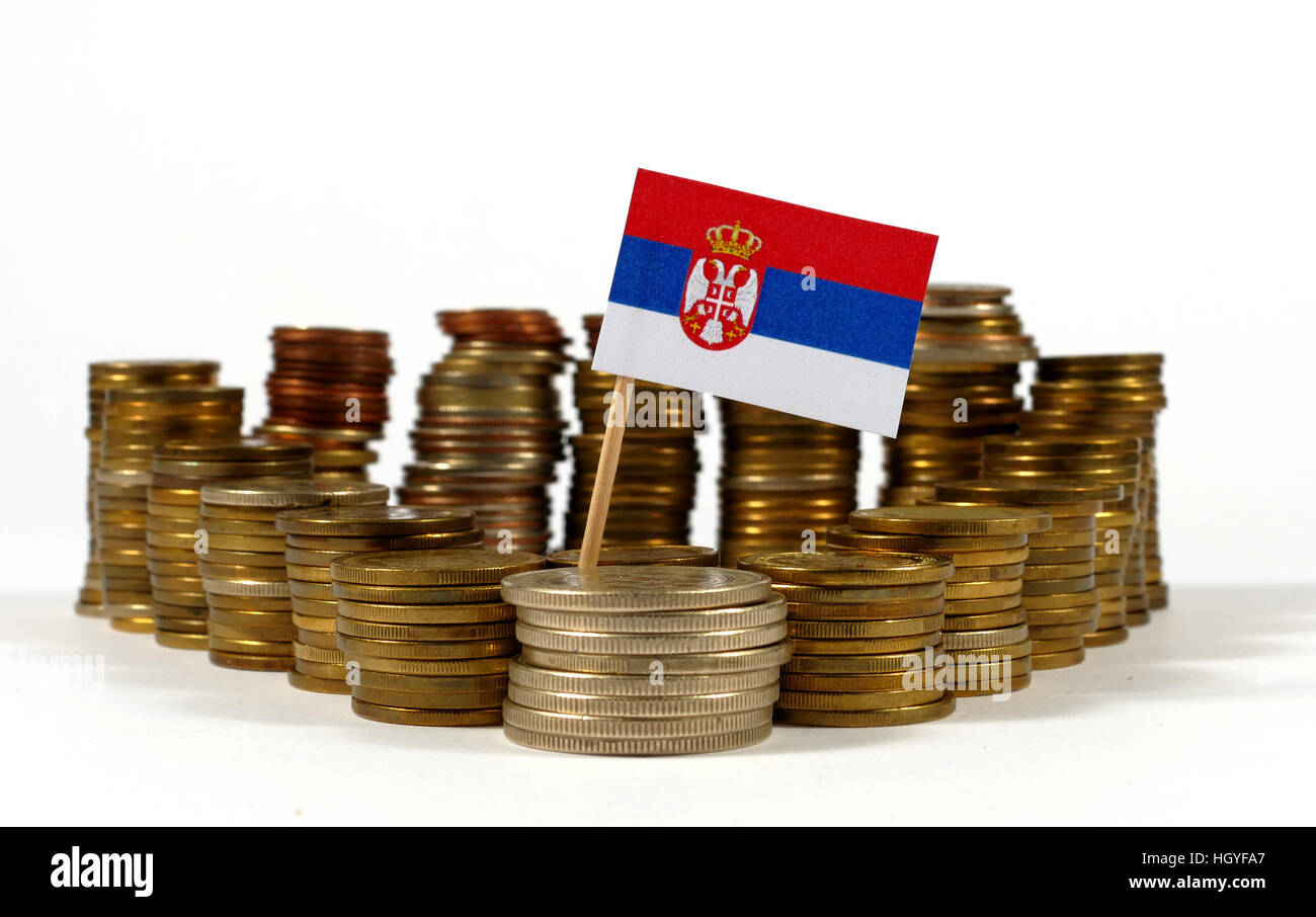 Serbia flag waving with stack of money coins Stock Photo