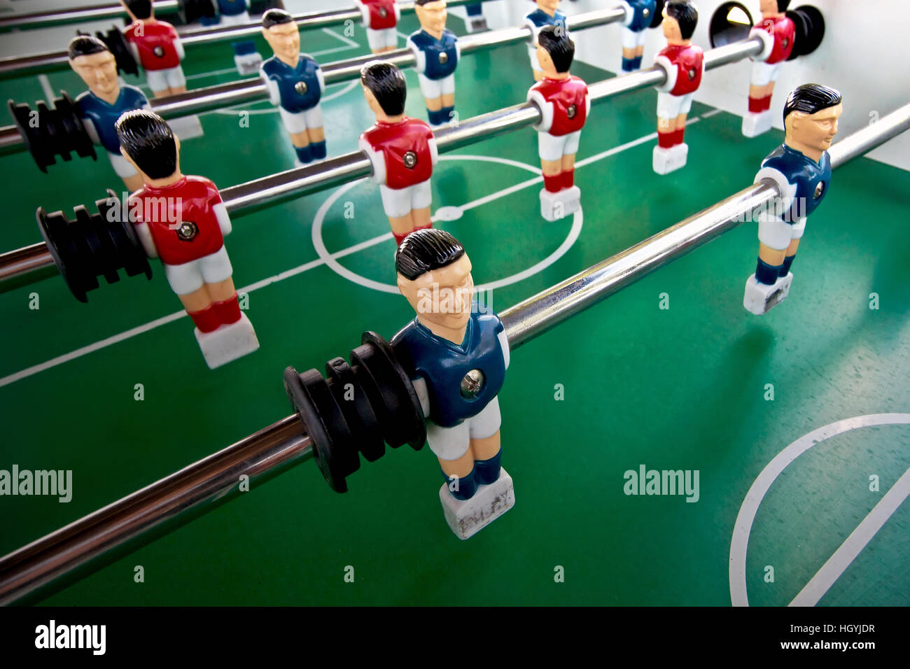 Miniature figures of  players fixed on rods . Stock Photo