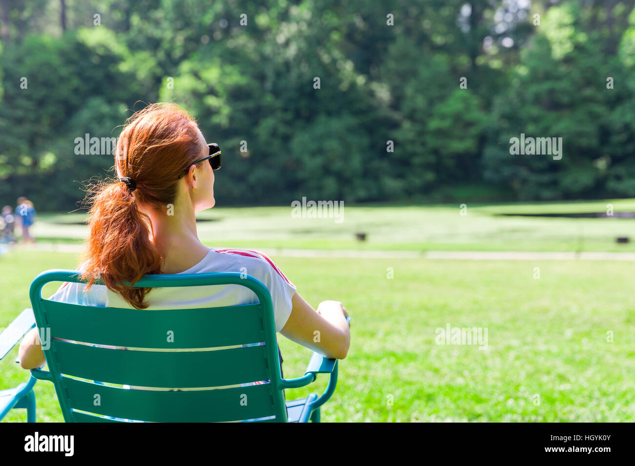 Woman in eyeglasses relax on greenfield Stock Photo Alamy