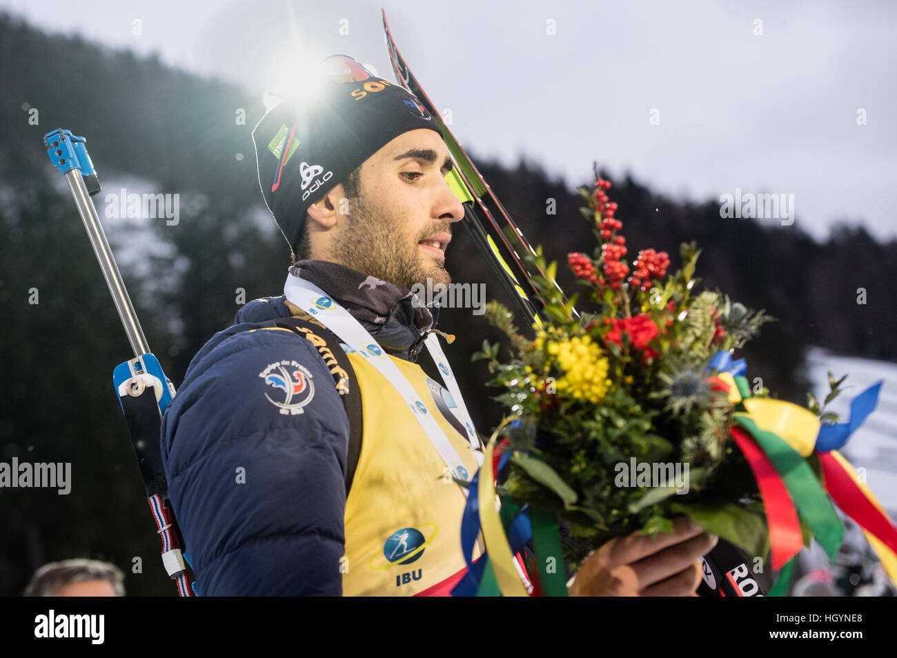 Ruhpolding, Germany. 13th Jan, 2017. French biathlete Martin Fourcade on the victors' podium after competing in the men's 10 kilometer sprint at the Biathlon World Cup in the Chiemgau Arena in Ruhpolding, Germany, 13 January 2017. Fourcade finished in 1st place, Eberhard in 2nd place and Svendsen in 3rd place. Photo: Matthias Balk/dpa/Alamy Live News Stock Photo
