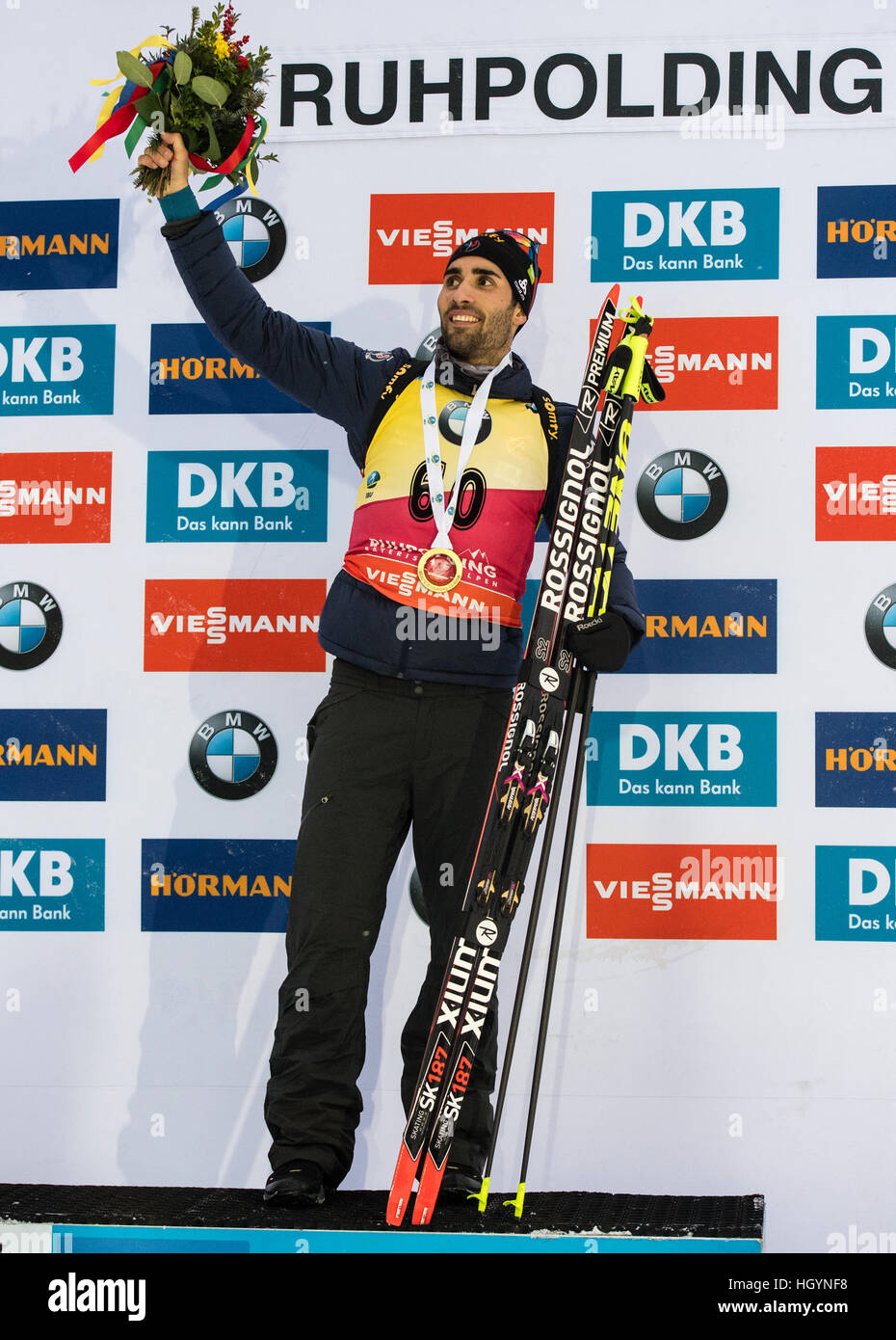 Ruhpolding, Germany. 13th Jan, 2017.  French biathlete Martin Fourcade on the victors' podium after competing in the men's 10 kilometer sprint at the Biathlon World Cup in the Chiemgau Arena in Ruhpolding, Germany, 13 January 2017. Fourcade finished in 1st place, Eberhard in 2nd place and Svendsen in 3rd place. Photo: Matthias Balk/dpa/Alamy Live News Stock Photo
