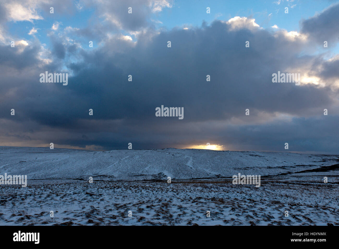 Elan Valley, Powys, Wales, UK. 13th January, 2017. An ominous sky is seen at sunset.Strong wind causes drifting of snow on the mountain road at Elan Valley in Powys, Wales, UK. © Graham M. Lawrence/Alamy Live News. Stock Photo