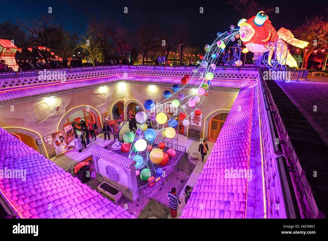 Sanmenxia, China's Henan Province. 13th Jan, 2017. Tourists visit a lantern fair held at underground cave dwellings in Shanzhou District of Sanmenxia, central China's Henan Province, Jan. 13, 2017. The lantern fair displaying 151 illuminated lantern groups kicked off on Friday and will last till Feb. 28. The underground cave dwelling in Shanzhou is a specific architectural style in western regions of Henan. © Li Bo/Xinhua/Alamy Live News Stock Photo