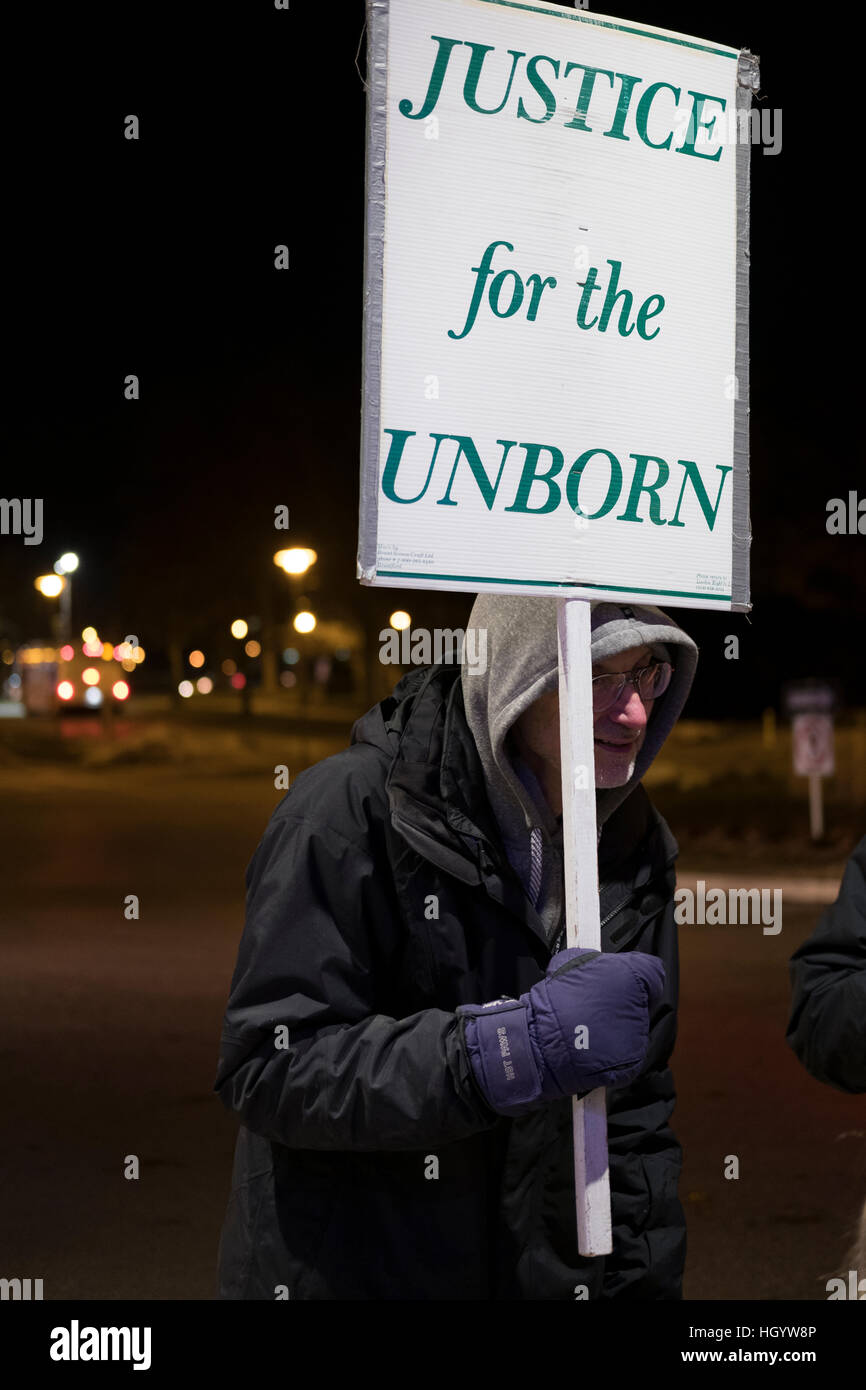 London, Ontario, Canada, 13th January, 2017. Protesters hold signs in front of the Alumni Hall of London's University of Western Ontario, where the Prime Minister of Canada, was participating on a town hall Q&A. London was one of his stops as part of his cross-country tour. Credit: Rubens Alarcon/Alamy Live News Stock Photo