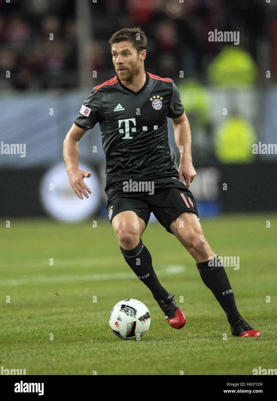 Duesseldorf, Germany. 14th Jan, 2017. Bayern's Xabi Alonso in action during the Telekom Cup soccer match between Fortuna Duesseldorf and Bayern Munich in the ESPRIT arena in Duesseldorf, Germany, 14 January 2017. Photo: Federico Gambarini/dpa/Alamy Live News Stock Photo